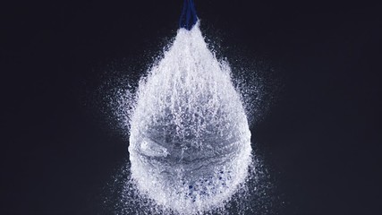 Phantom Camera Water Balloon Explosion on black background slow motion - Powered by Adobe