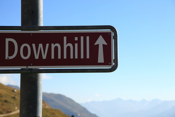 Obraz premium Downhill sign for mountain bikes single track descent close to Aletsch glacier in the Swiss alps