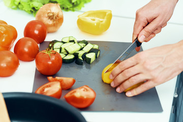 woman cutting vegetables in the kitchen