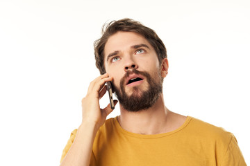 young man talking on the phone isolated on white