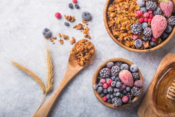 Morning  Granola, Fruits, Berries in bowl on grey concrete background. Healthy breakfast cereals. Concept of dieting, healthy  clean eating