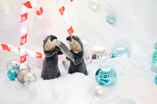 Christmas beavers with fish and christmas stick)