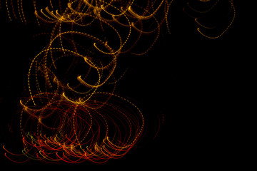 Fantasy christmas background. diffused swirling lights on a black background