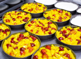 Fresh summer cake with fresh strawberries and pineapple berries in syrup for dessert, decoration