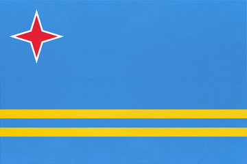 Fototapeta premium Aruba national fabric flag textile background. State official caribbean sign.