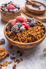 Morning  Granola, Fruits, Berries in bowl on grey concrete background. Healthy breakfast cereals. Concept of dieting, healthy  clean eating