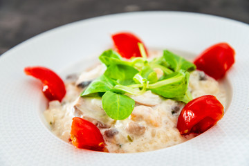 risotto with fresh cream, salted chicken, rehydrated ceps and mushrooms