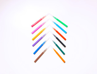 Colorful felt-tip pens on the white background. Markers and pencils pattern. Background or texture.