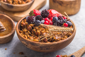Morning  Granola, Fruits, Berries in bowl on grey concrete background. Healthy breakfast cereals. Concept of dieting, healthy  clean eating