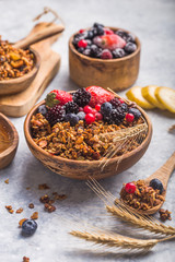 Morning  Granola, Fruits, Berries in bowl on grey concrete background. Healthy breakfast cereals. Concept of dieting, healthy  clean eating