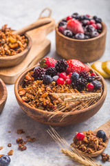 Morning  Granola, Fruits, Berries in bowl on grey concrete background. Healthy breakfast cereals. Concept of dieting, healthy  clean eating