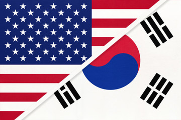 USA vs South Korea national flag from textile. Relationship between two american and asian countries.