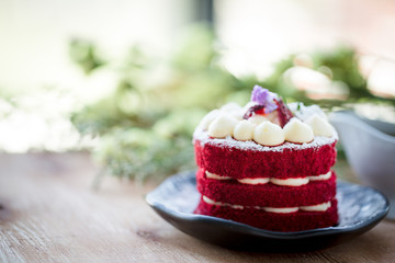Red Velvet homemade cake decorated with cream.