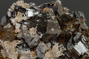 macro mineral cassiterite stone on gray background