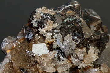 macro mineral cassiterite stone on gray background