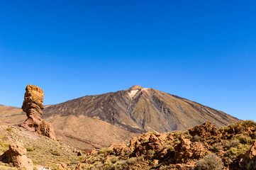 Highest Peak Behind Roque Cinchado On A Sunny And Very Clear Day In El Teide National Park. April 13, 2019. Santa Cruz De Tenerife Spain Africa. Travel Tourism Street Photography.