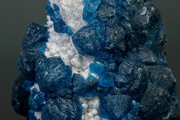 macro mineral stone Fluorite on quartz on a gray background