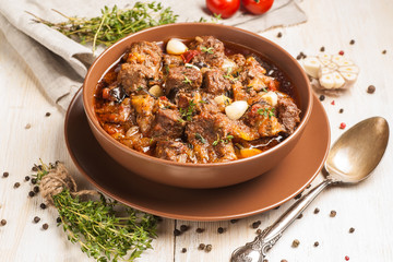 Braised meat with vegetables in a thick sauce.