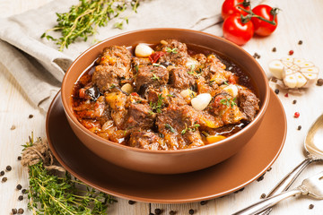Braised meat with vegetables in a thick sauce.