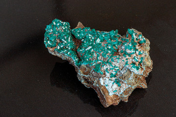 macro mineral stone Dioptase on a gray background