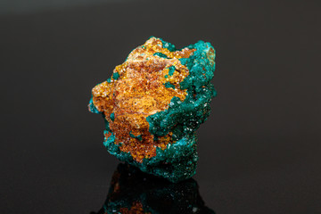 macro mineral stone Dioptase on a gray background
