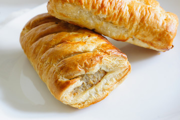 Freshly baked pork sausage rolls made with puff pastry fresh out of the oven
