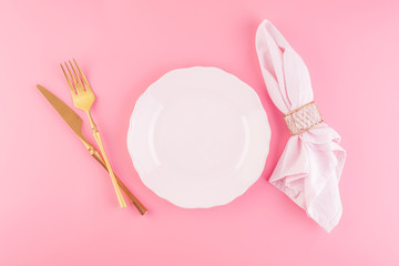 Festive table setting in luxurious pink pastel color.