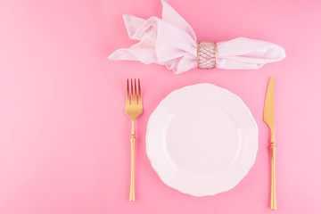 Festive table setting in luxurious pink pastel color.