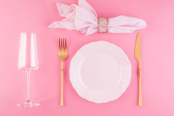 Festive table setting in luxurious pink pastel color.