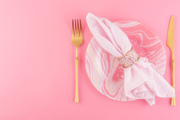 Festive table setting in luxurious pink pastel color.