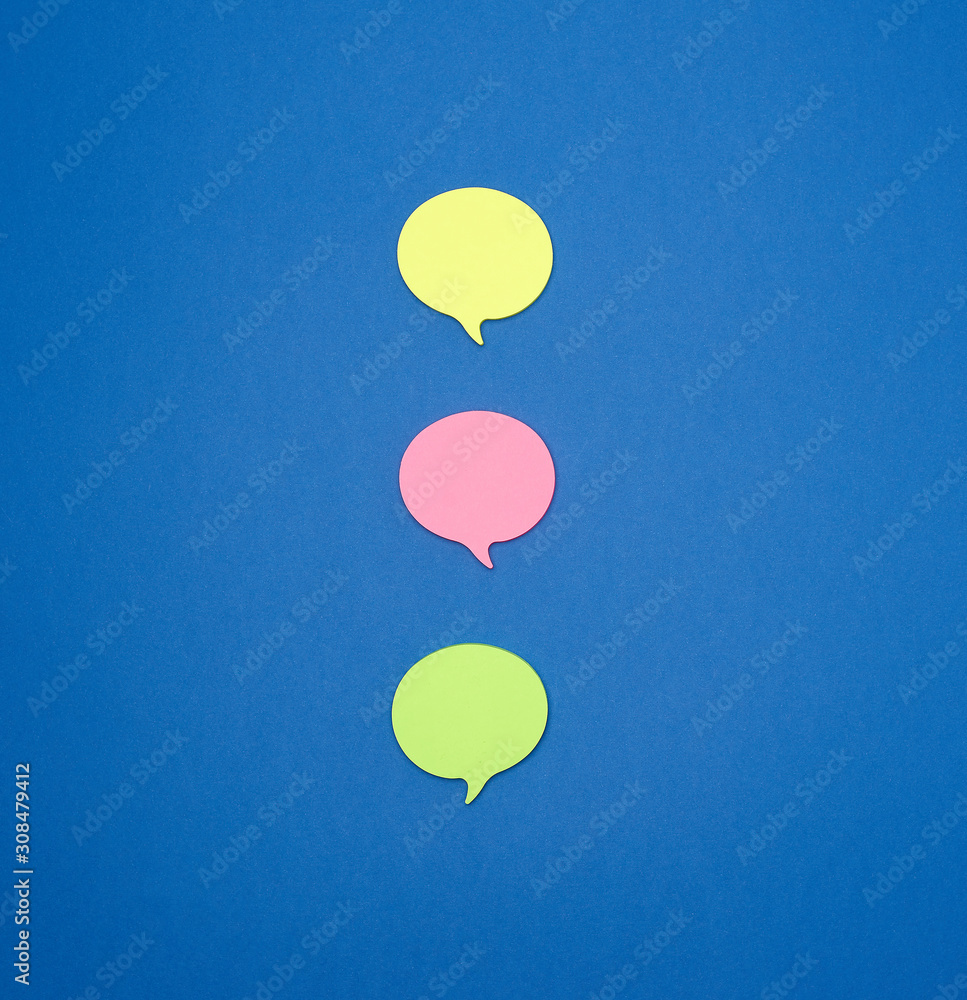 Poster multicolored empty paper stickers in the form of clouds on a blue background