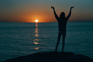 silhouette of a woman at sunset