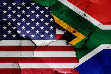 flags of USA and South Africa painted on cracked wall