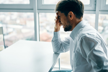 businessman talking on cell phone in office