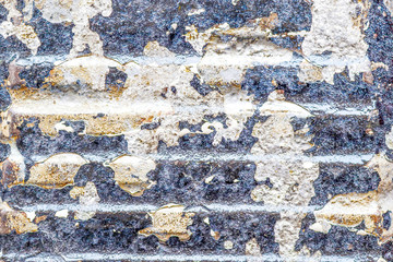 High resolution close up view on a detailed concrete wall texture with some cracks