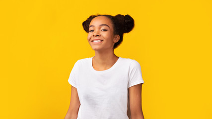 Portrait of confident black teen smiling at camera
