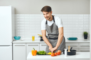 man preparing food in the kitchen