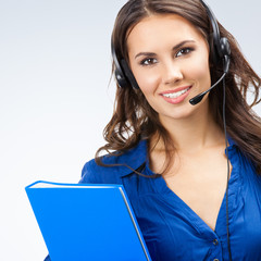 Portrait of happy smiling cheerful beautiful young support phone operator or sales phone agent in...