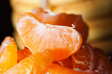 Slices of tangerine macro closeup on background of homemade cookies, holidays time, Easter or Christmas