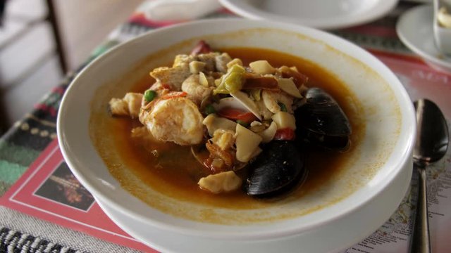 Soup with mussels and seafood, beautiful dish