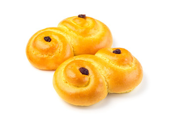 Traditional Swedish and scandinavian Christmas saffron buns Lussekatter, isolated on a white background, horizontal