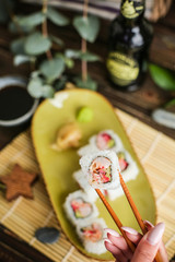 sushi with salmon and avocado. Sushi roll with salmon and tempura shrimp