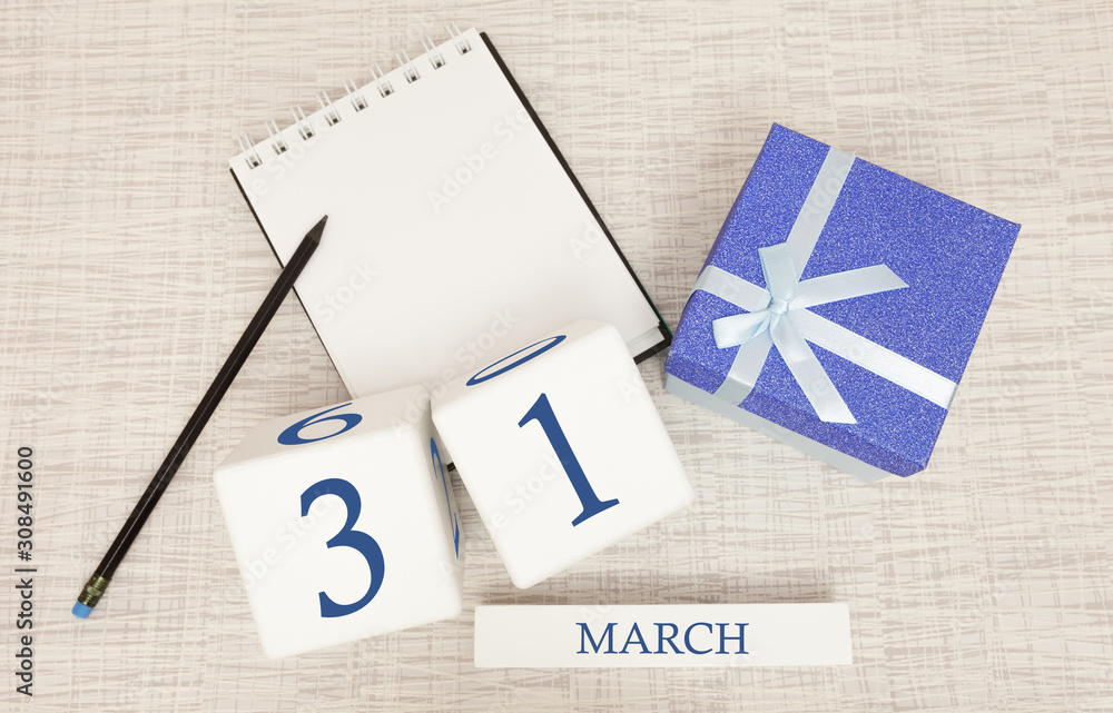 Wall mural calendar with trendy blue text and numbers for march 31 and a gift in a box.