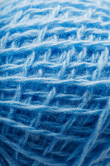 Wool yarn close-up colorful blue threads for needlework in macro.