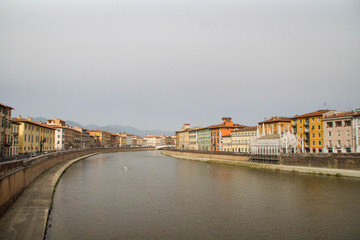 Obraz premium Day view over Arno river in Pisa, Tuscany, Italy