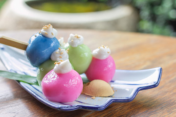 Mochi Japanese dessert is cute and tasty colorful on wood table