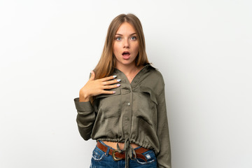 Lithuanian blonde girl over isolated white background surprised and shocked while looking right