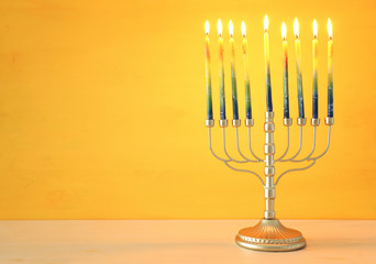 Religion image of jewish holiday Hanukkah background with menorah (traditional candelabra) and candles