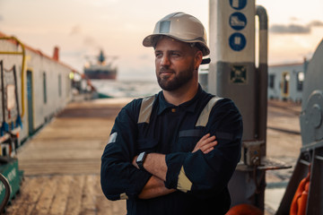 Marine Deck Officer or Chief mate on deck of offshore vessel or ship , wearing PPE personal...