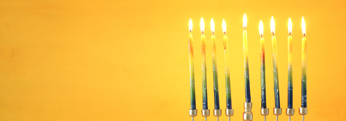 Religion image of jewish holiday Hanukkah background with menorah (traditional candelabra) and candles